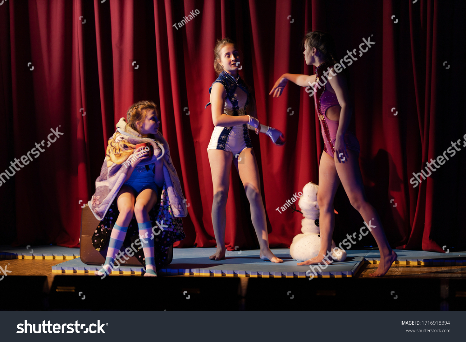 stock-photo-girls-show-the-performance-on-stage-in-the-theater-1716918394